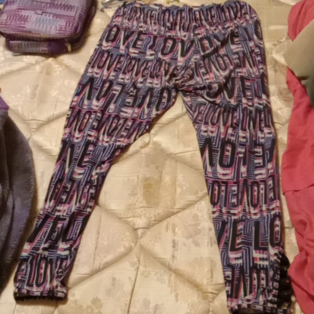 Purple love stretchy leggings size medium/ cute design at bottom of pant legs